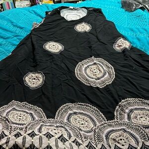 Black dress with circular pattern Size: Medium or Large